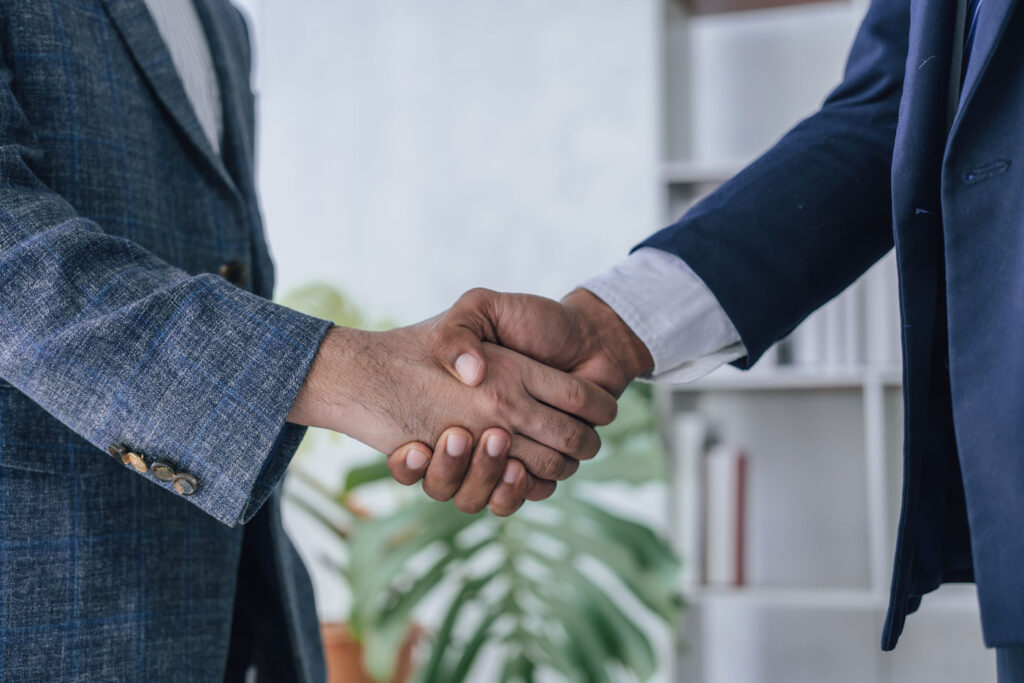 handshake between two business men